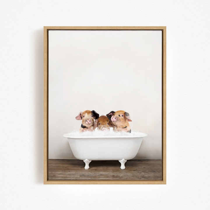 Three adorable brown and white pigs sitting in a white bathtub, enjoying a relaxing bath.