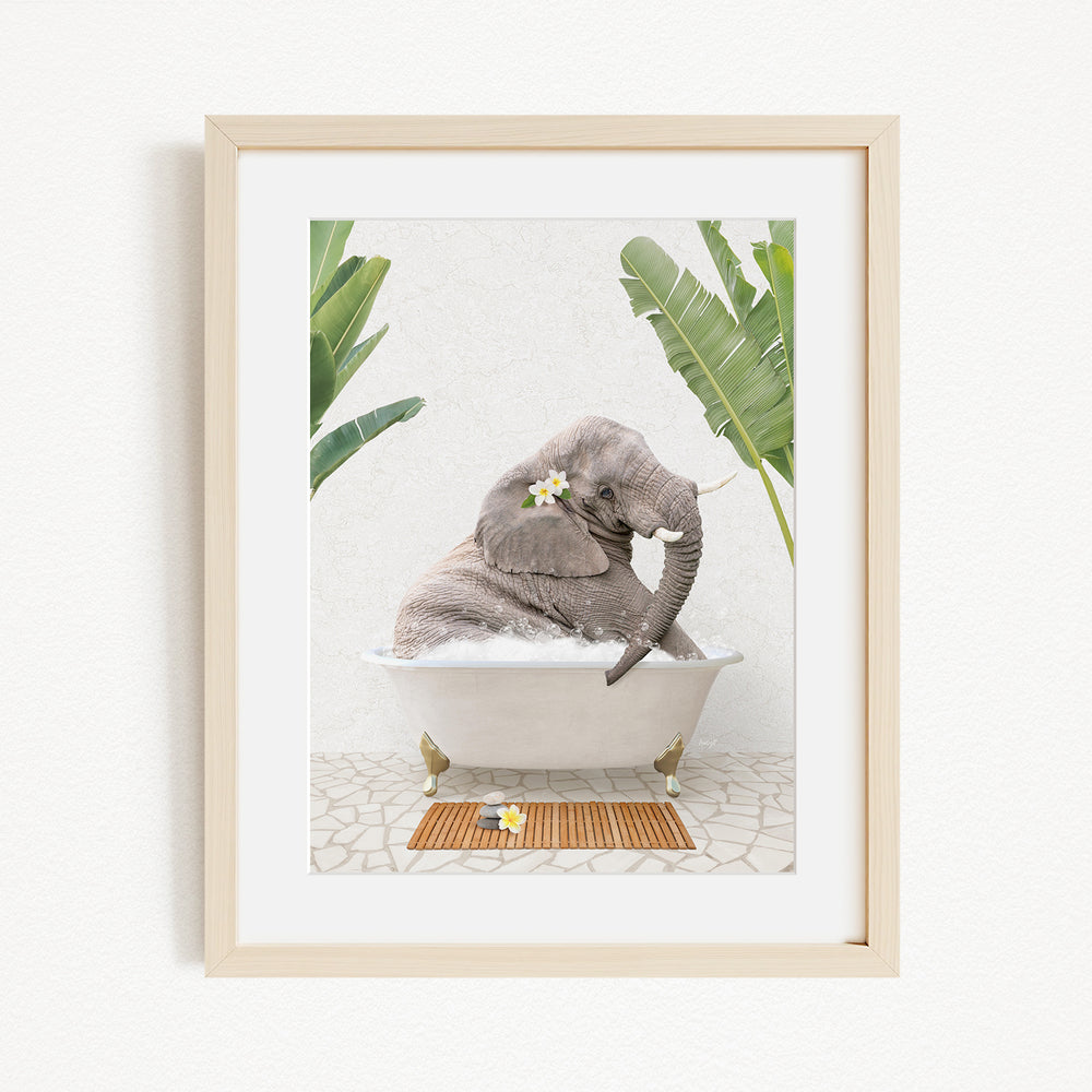 A gray elephant is sitting in a white bathtub, surrounded by green leaves and flowers, creating a whimsical and serene scene.