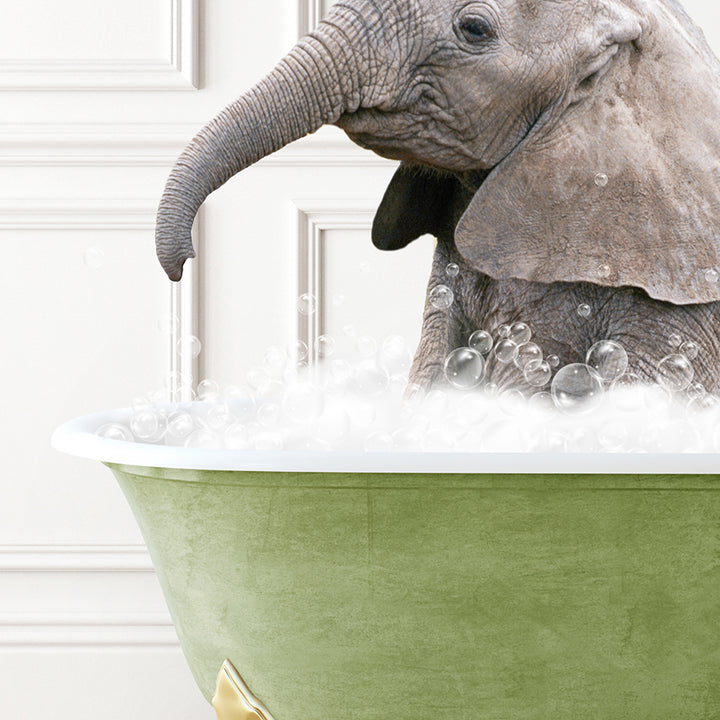 a baby elephant sitting in a bathtub full of bubbles