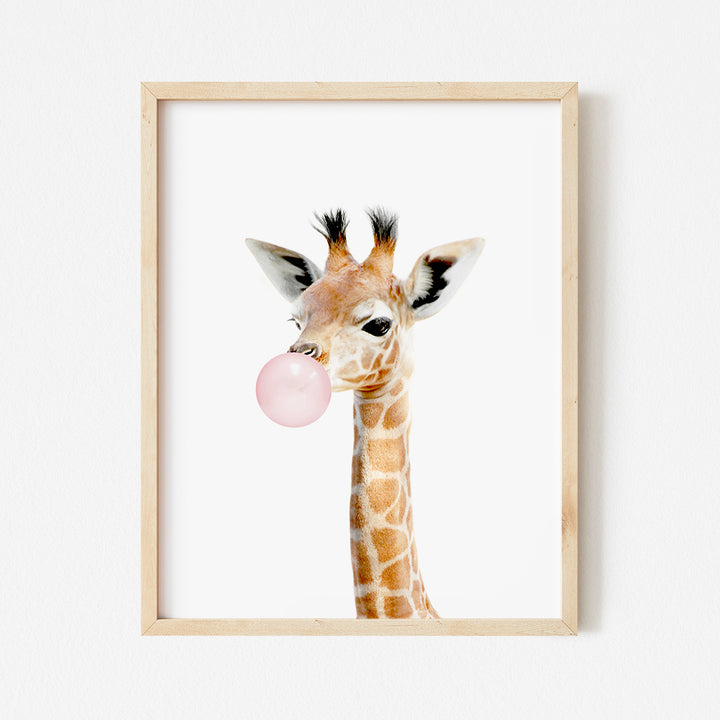 a picture of a giraffe with a bubble in its mouth