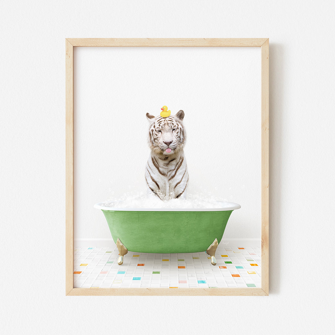 a white tiger sitting in a green bath tub