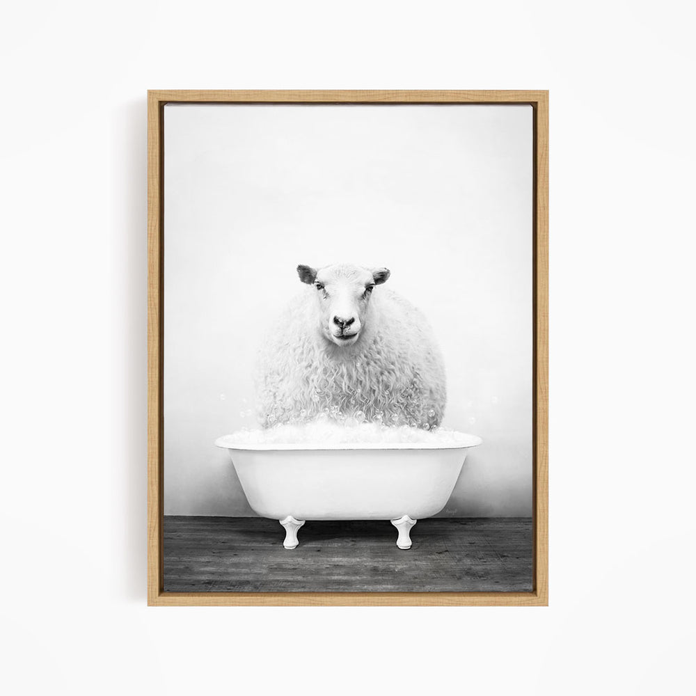 A fluffy white sheep sits in a white bathtub filled with bubbles, creating a whimsical and playful scene.