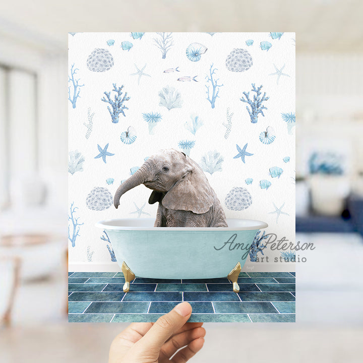 a hand holding up a card with an elephant in a bathtub