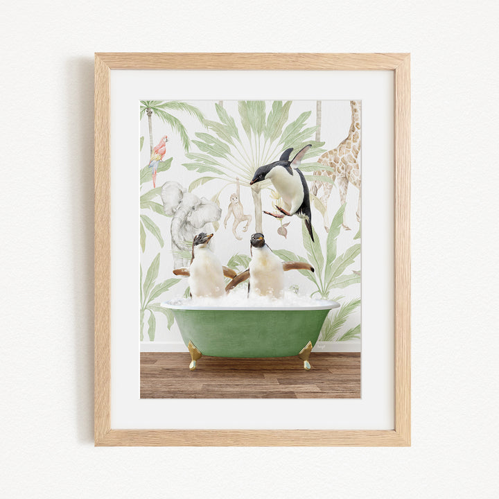 A framed image depicting three penguins sitting in a green bathtub, surrounded by a tropical jungle-themed wallpaper.