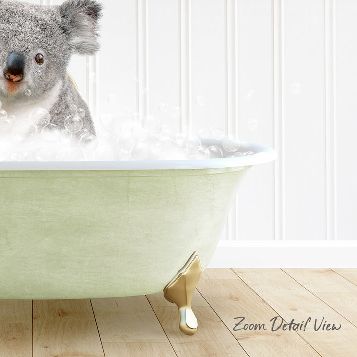 A koala bear sitting in a green bathtub filled with bubbles, with a wooden floor and white walls in the background.