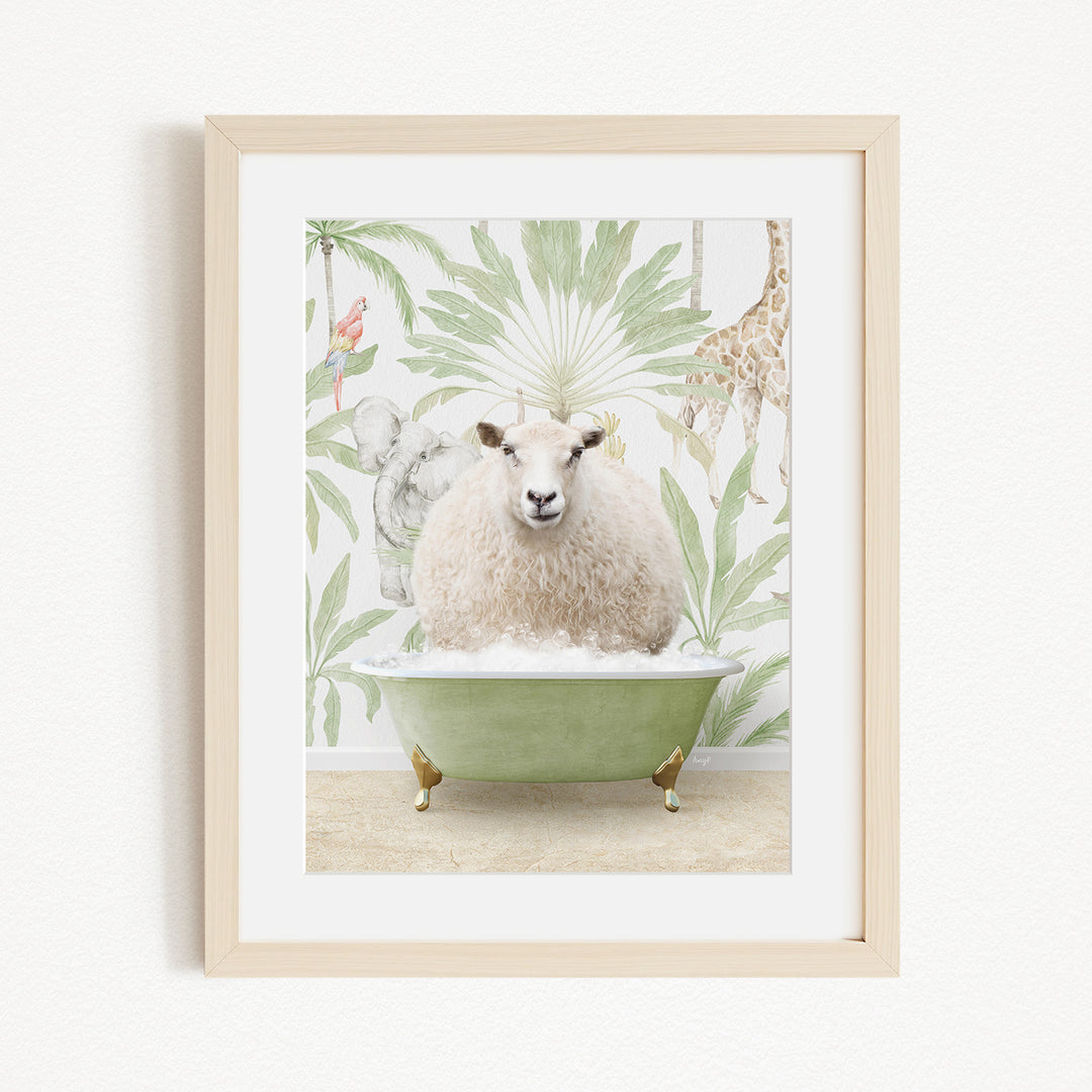 A framed image depicting a sheep sitting in a green bathtub, surrounded by a tropical wallpaper with various animals.
