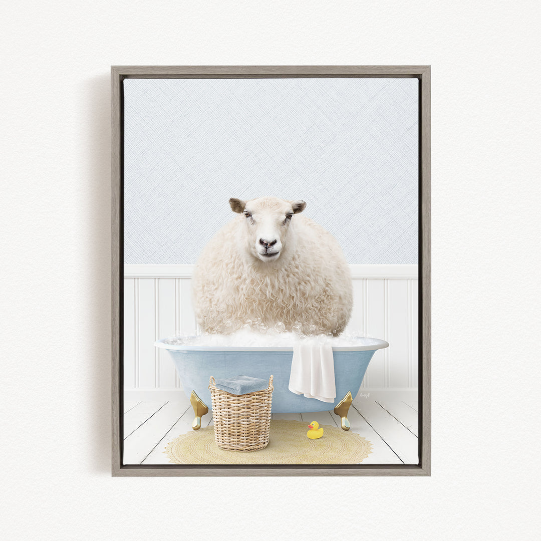 A fluffy white sheep sits in a blue bathtub filled with bubbles, surrounded by a yellow rubber duck and a wicker basket.