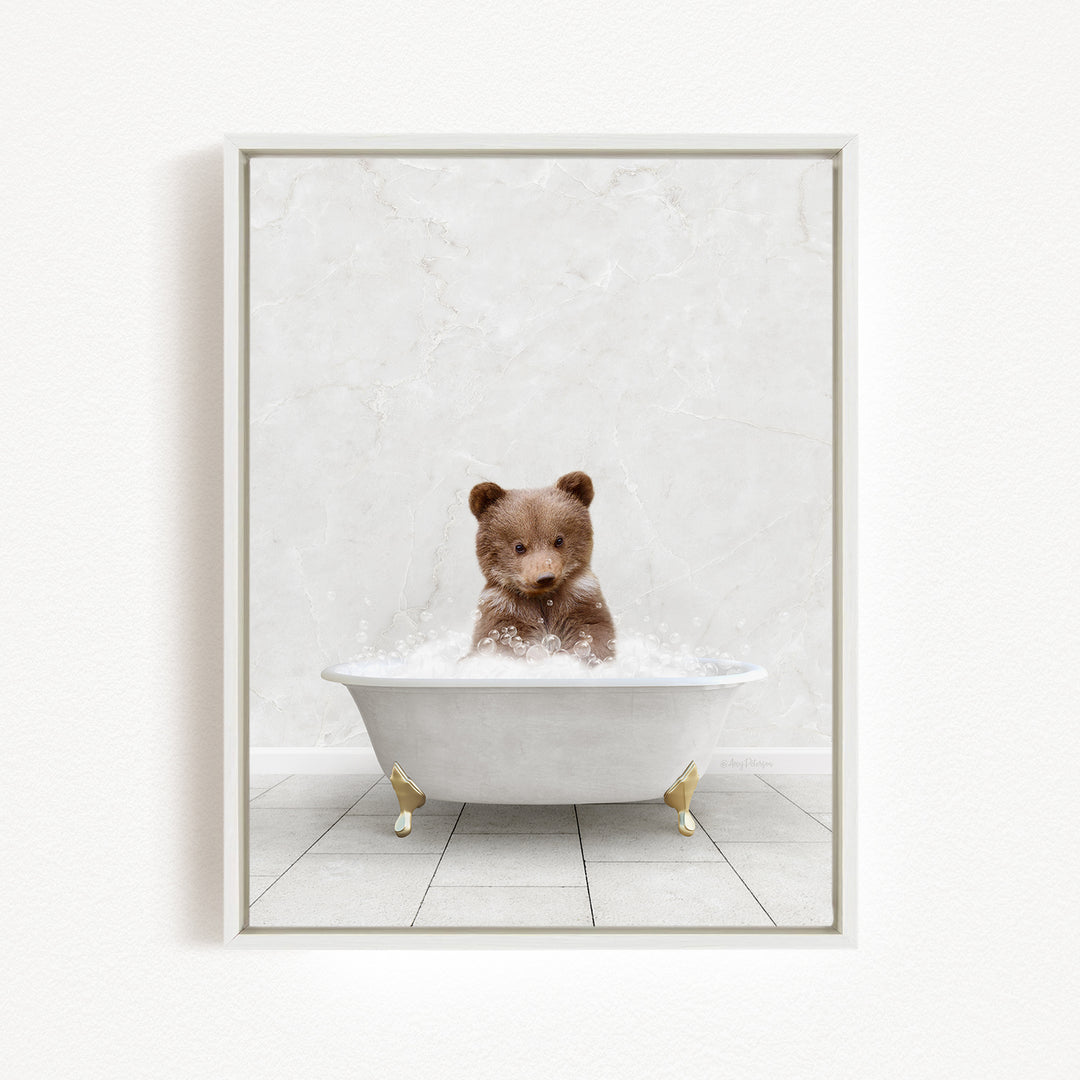 A brown bear sitting in a white bathtub filled with water, creating a playful and whimsical scene.