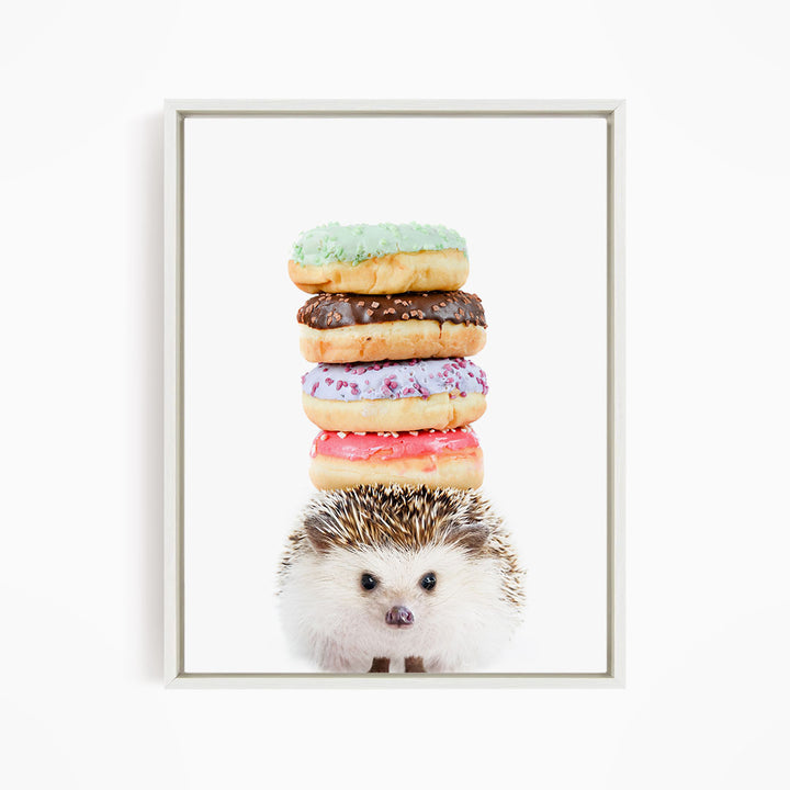 A hedgehog is sitting in front of a stack of colorful donuts, with the donuts piled on top of the hedgehog.
