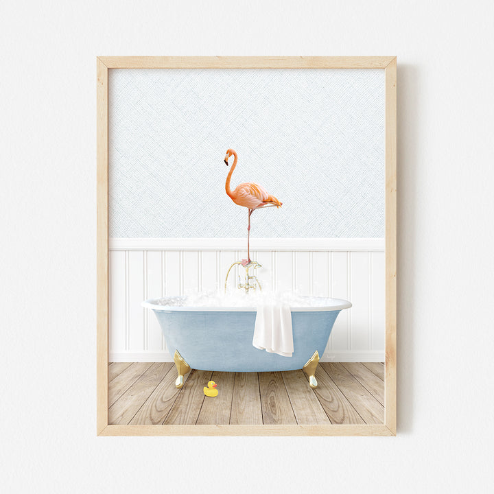 a pink flamingo standing on top of a blue bath tub