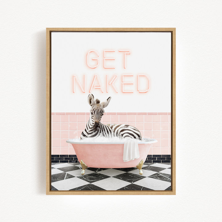 A zebra sitting in a pink bathtub with the text "GET NAKED" displayed above it.