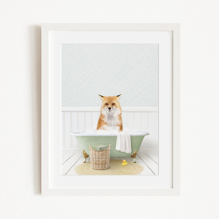 A red fox is sitting in a green bathtub filled with bubbles, surrounded by rubber ducks and a basket.