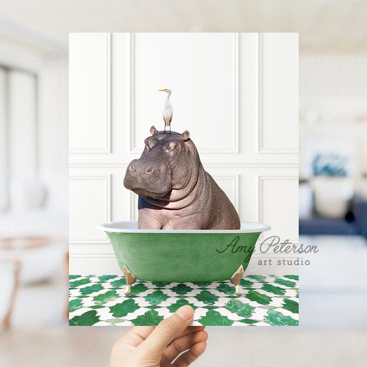 a hippo sitting in a green bathtub with a bird on top of it