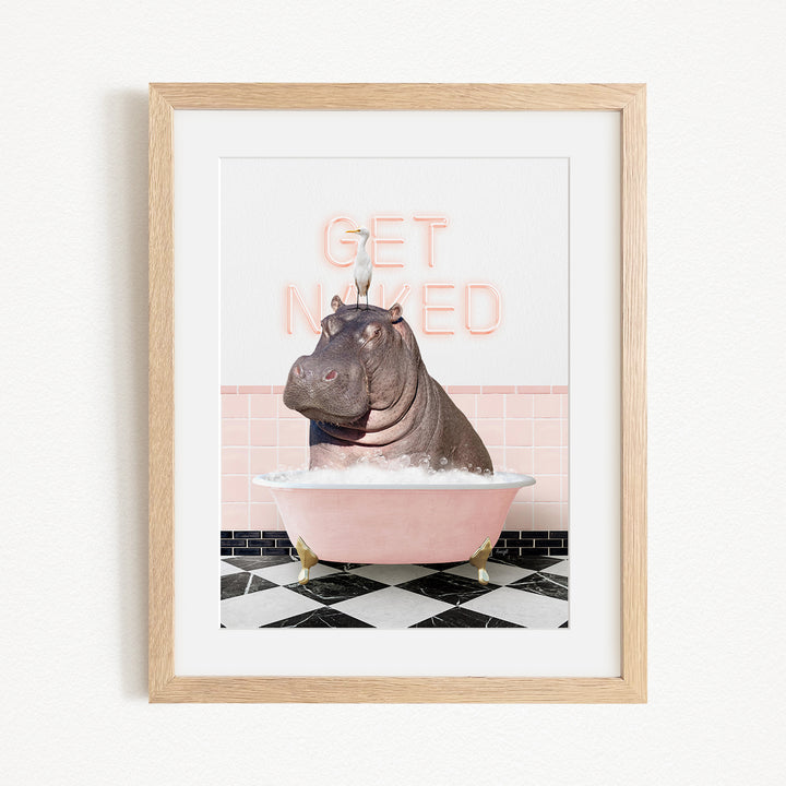 A framed image depicting a hippopotamus sitting in a pink bathtub, with the text "GET NICKED" displayed above it.