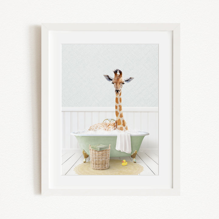 A giraffe standing in a green bathtub filled with bubbles, surrounded by a basket of toys and a yellow rubber duck.
