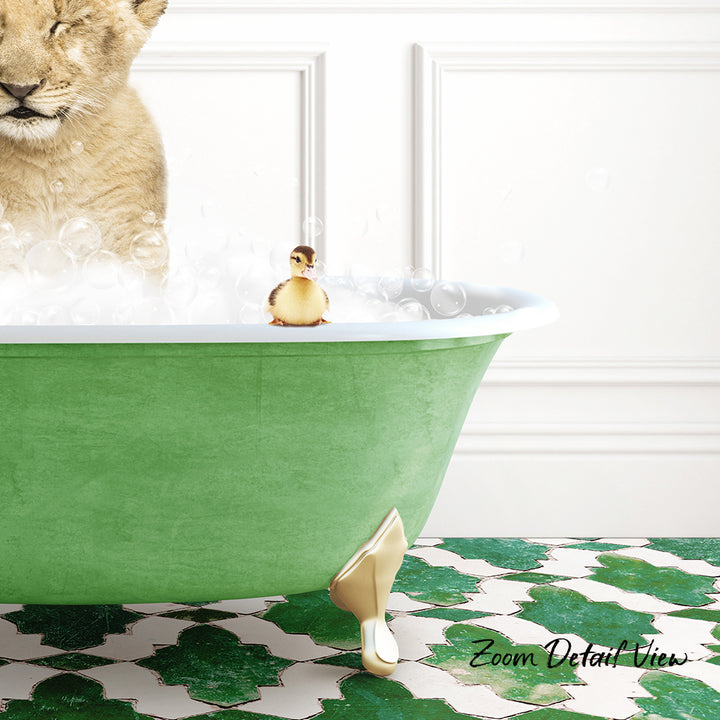 A lion cub is taking a bath in a green bathtub, with a small yellow duck sitting on the edge of the tub.