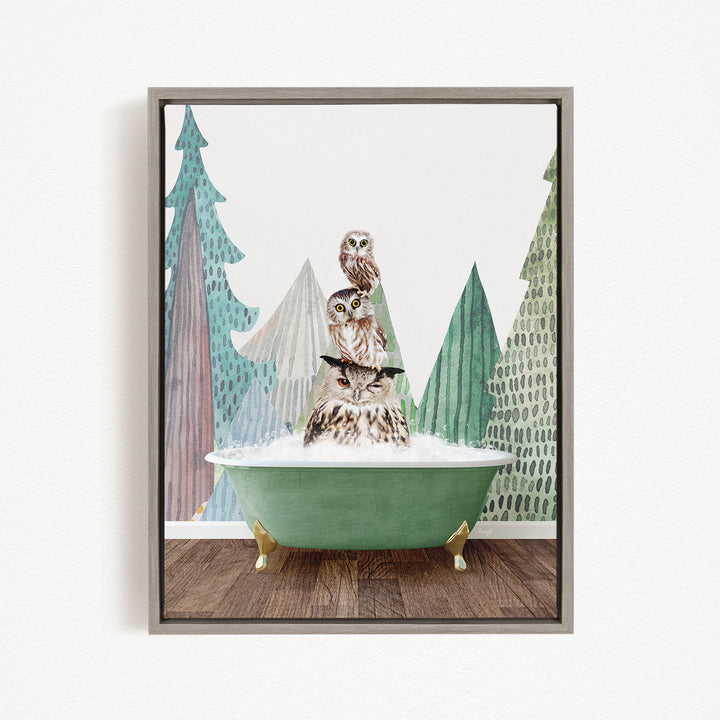 A framed print depicting three owls sitting in a green bathtub, with a forest backdrop.