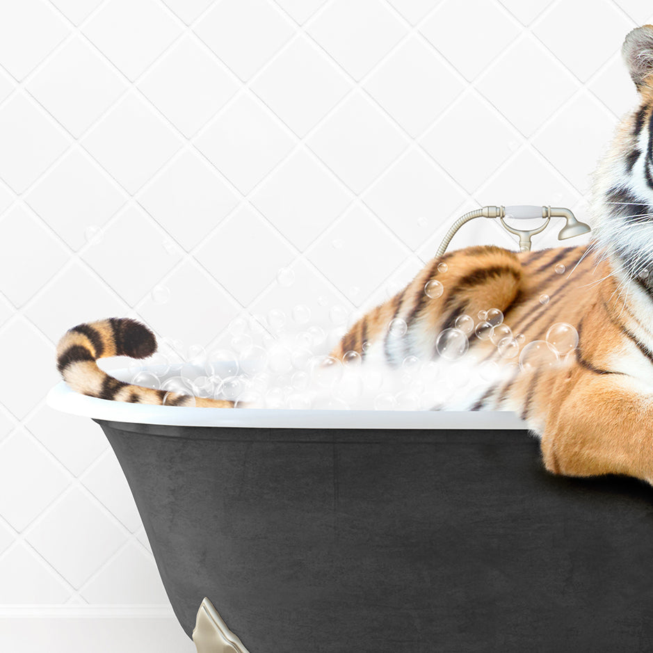 a stuffed tiger sitting in a bath tub