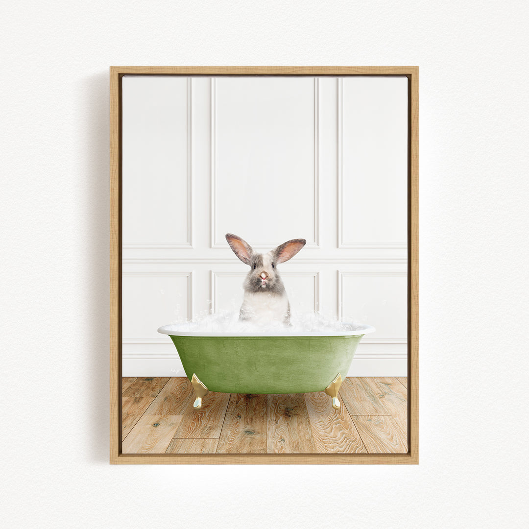 A white rabbit sitting in a green bathtub filled with water, with a wooden floor in the background.