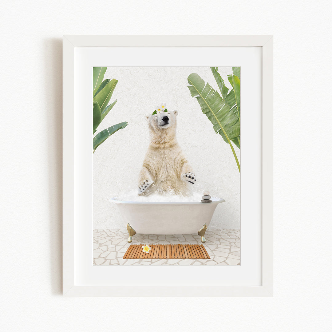 A polar bear standing in a bathtub filled with water, surrounded by green plants and a wooden mat on the floor.