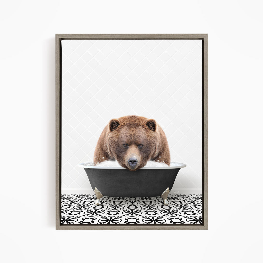 A brown bear is sitting in a bathtub filled with water, appearing to be enjoying the bath.