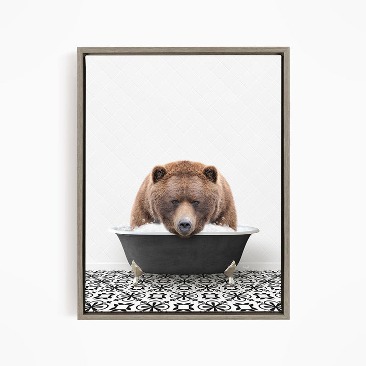 A brown bear is sitting in a bathtub filled with water, appearing to be enjoying the bath.