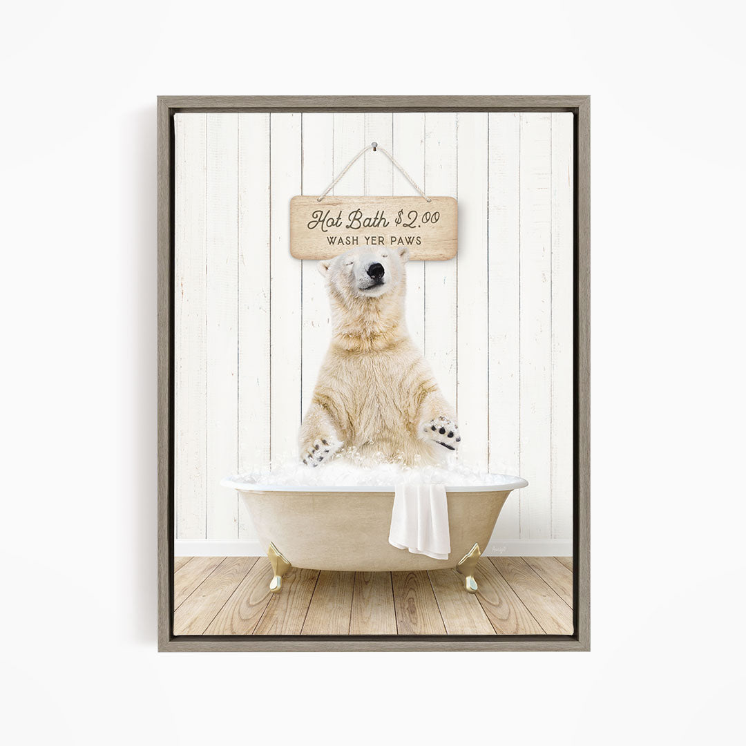 A polar bear sitting in a bathtub, with a sign above it that says "Hot Bath $2.00 WASH YOUR Paws".