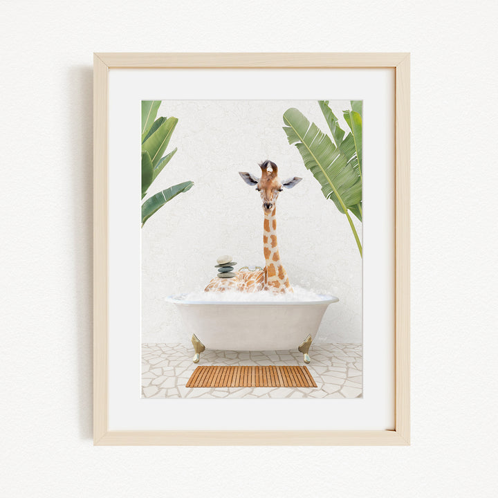 A giraffe sitting in a bathtub filled with bubbles, surrounded by green leaves, creating a whimsical and playful scene.
