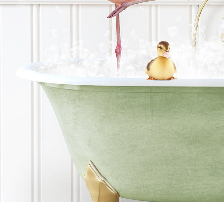 a bathtub filled with bubbles and a pink flamingo sitting on top of it