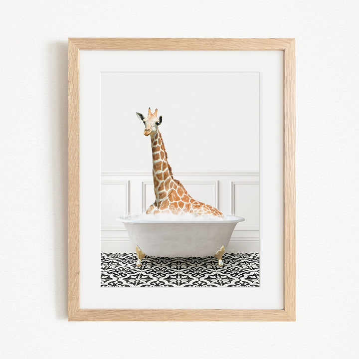 A giraffe sitting in a white bathtub filled with bubbles, creating a whimsical and playful scene.
