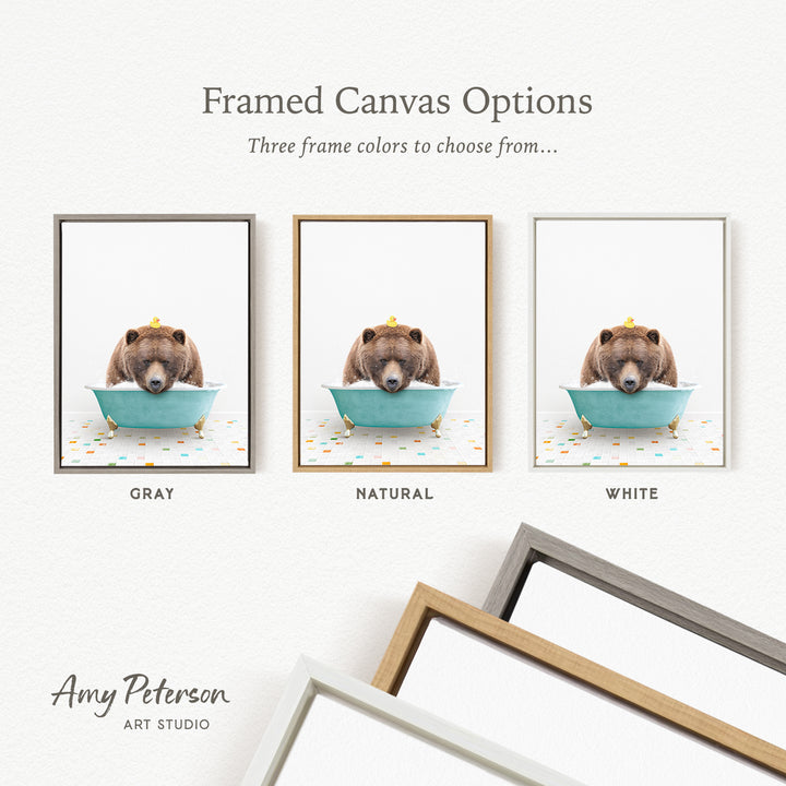 three framed canvas options featuring a brown bear sitting in a bathtub, each with a different frame color: gray, natural, and white.