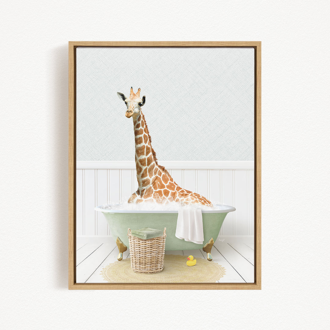 A giraffe sitting in a green bathtub filled with water, surrounded by a basket of toys and a yellow rubber duck.