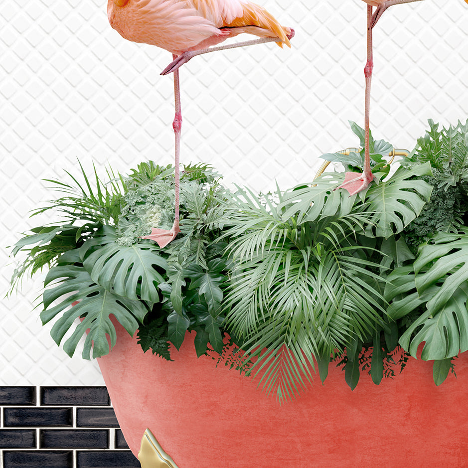 two flamingos standing on top of a plant pot