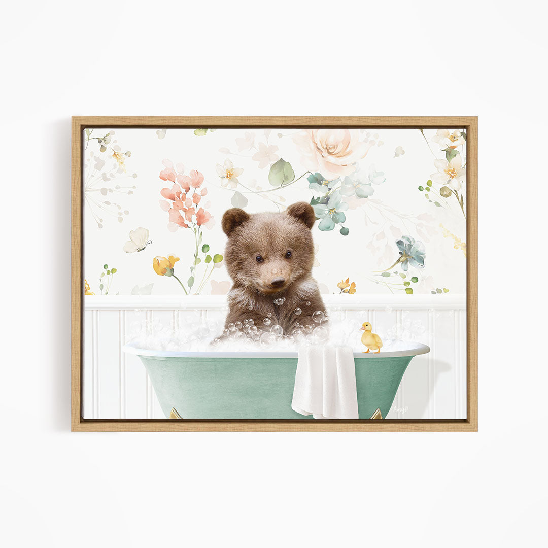 A cute brown bear sitting in a green bathtub filled with bubbles, surrounded by a floral wallpaper.