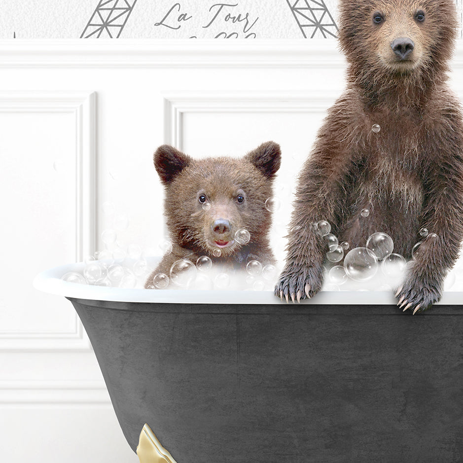 two brown bears are sitting in a bathtub