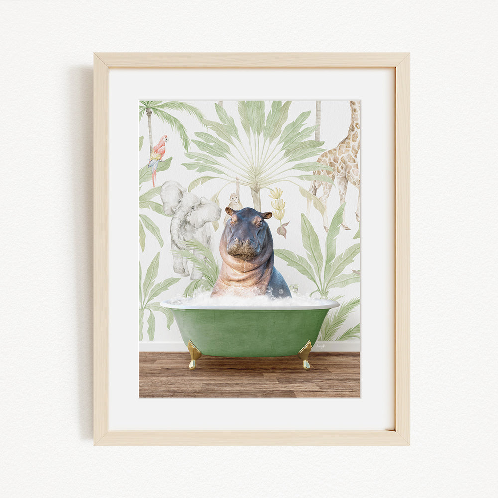 A framed print depicting a hippopotamus sitting in a green bathtub, surrounded by tropical foliage and animals.