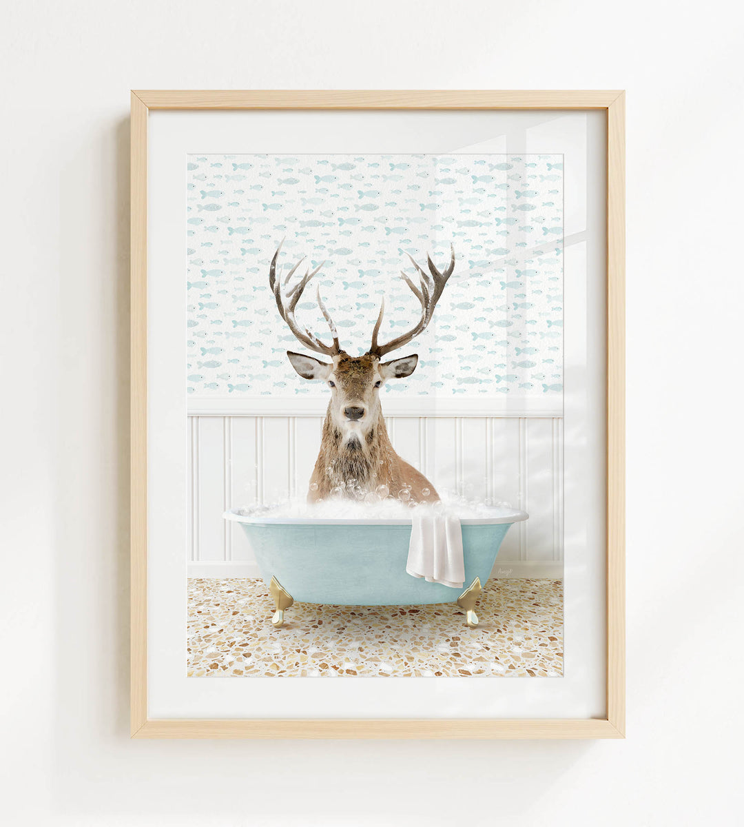 A deer with antlers is sitting in a blue bathtub filled with bubbles, surrounded by a patterned wall and a white floor.