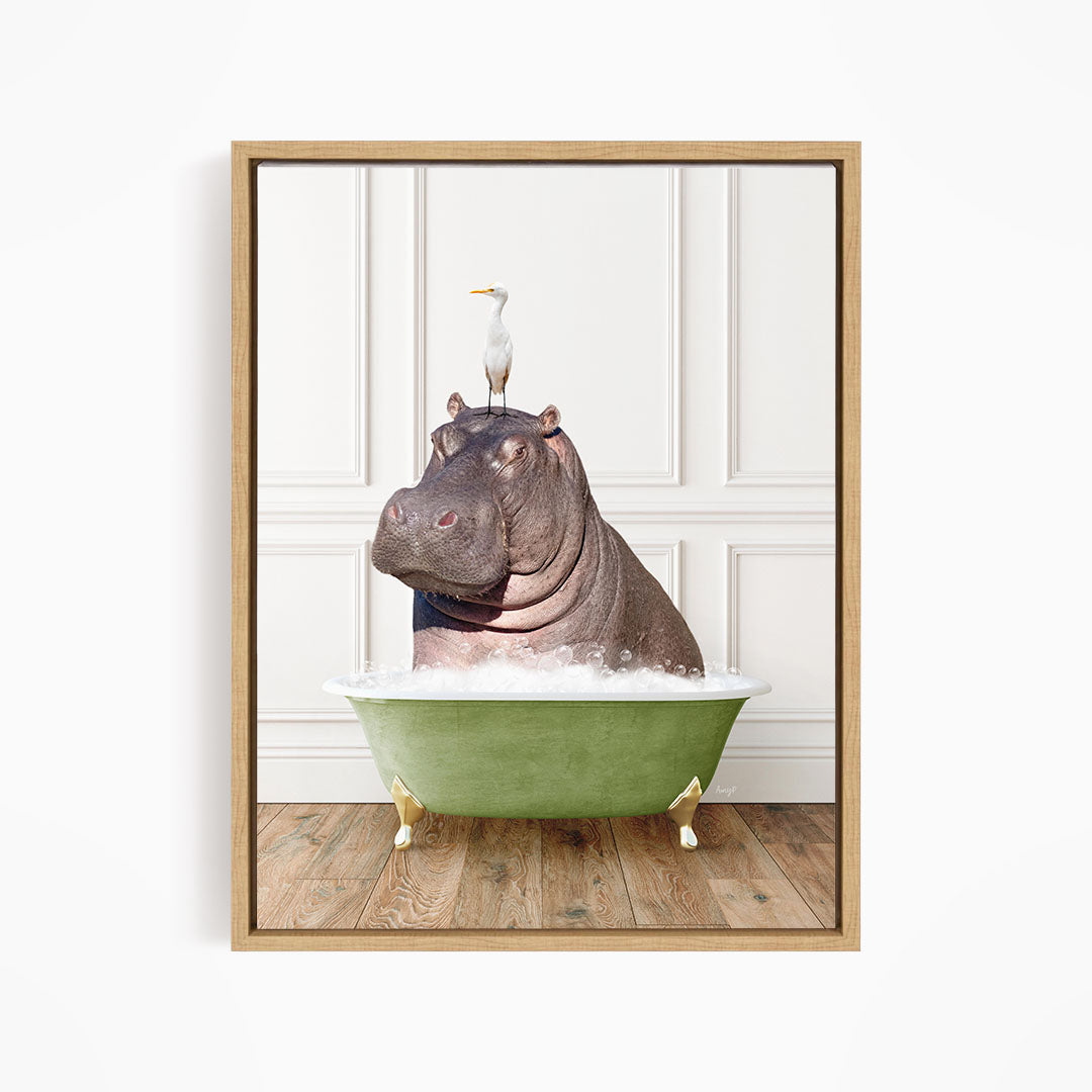 A framed image depicting a hippopotamus sitting in a green bathtub, with a seagull perched on its head.