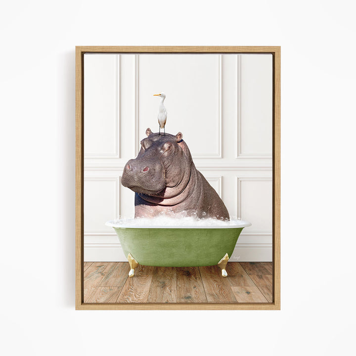 A framed image depicting a hippopotamus sitting in a green bathtub, with a seagull perched on its head.