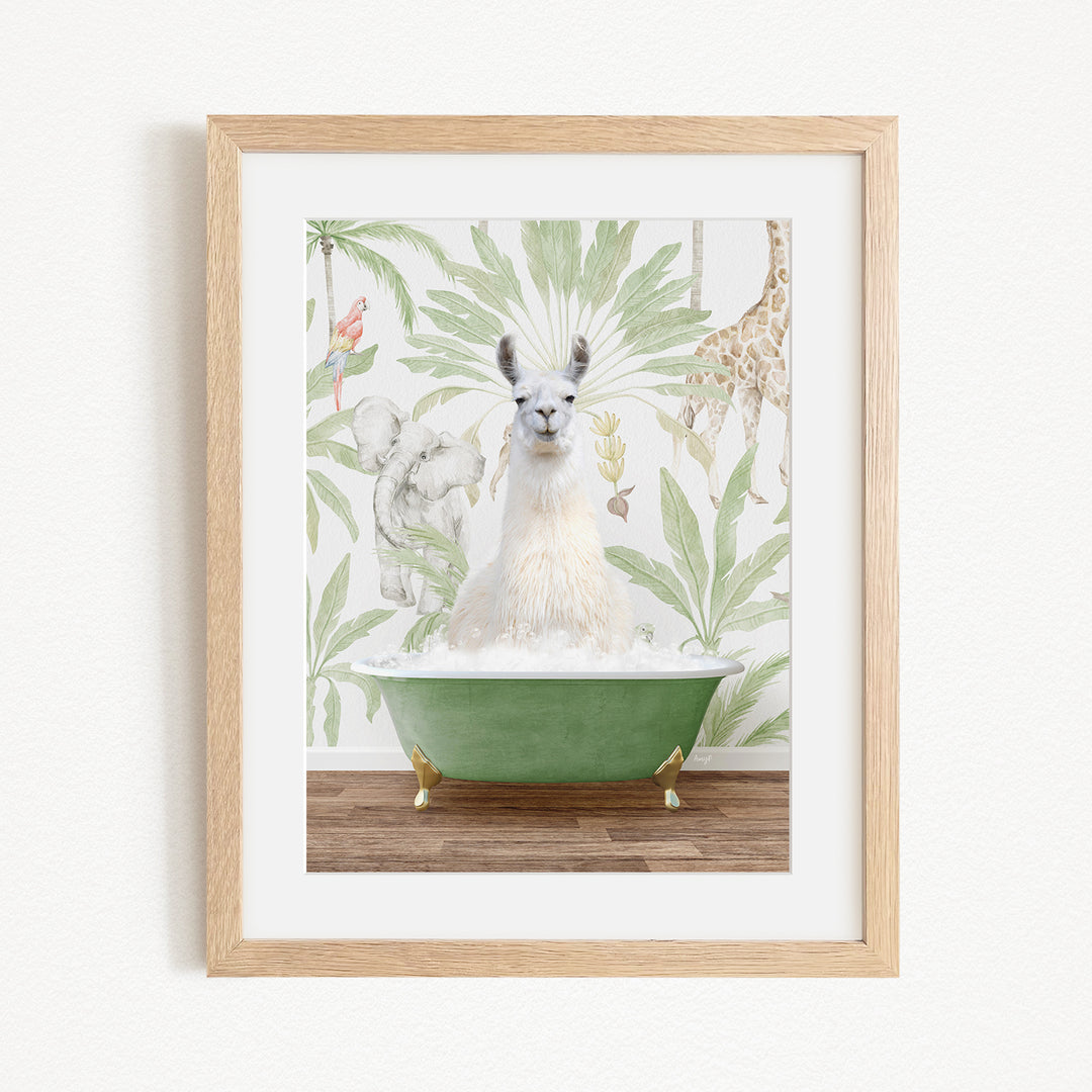 A framed image depicting a white llama sitting in a green bathtub, surrounded by a tropical jungle-themed wallpaper.