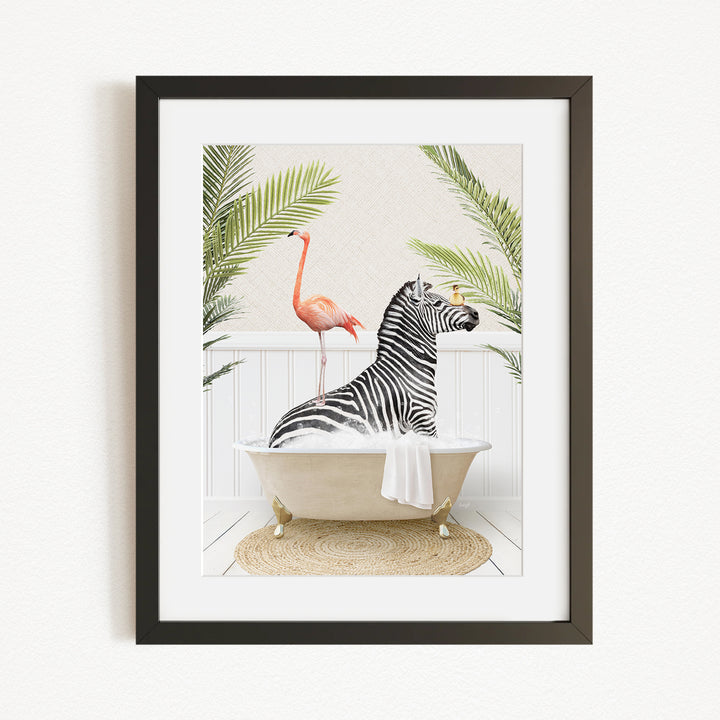 A framed image depicting a zebra sitting in a bathtub, with a pink flamingo standing on the edge of the tub.