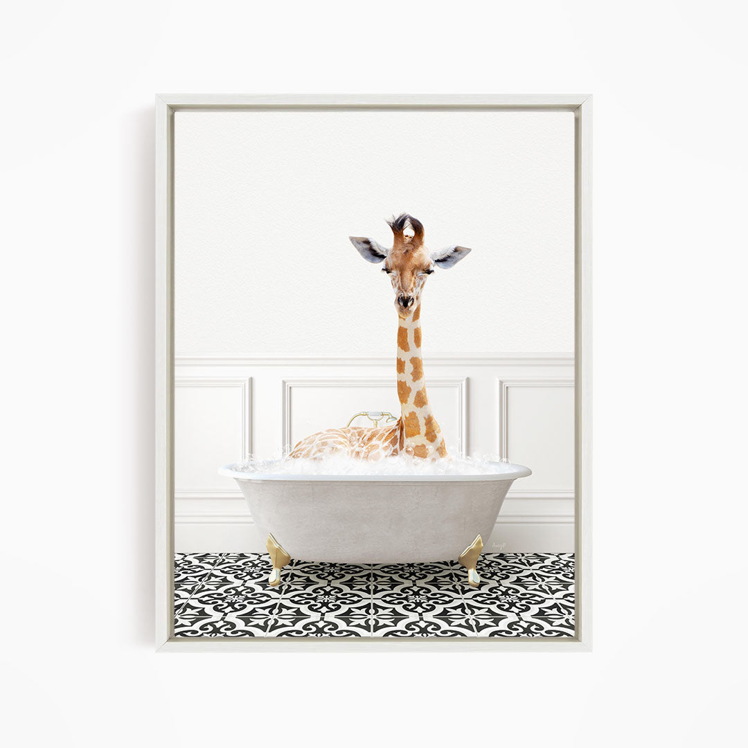 A giraffe is sitting in a white bathtub filled with bubbles, creating a whimsical and playful scene.