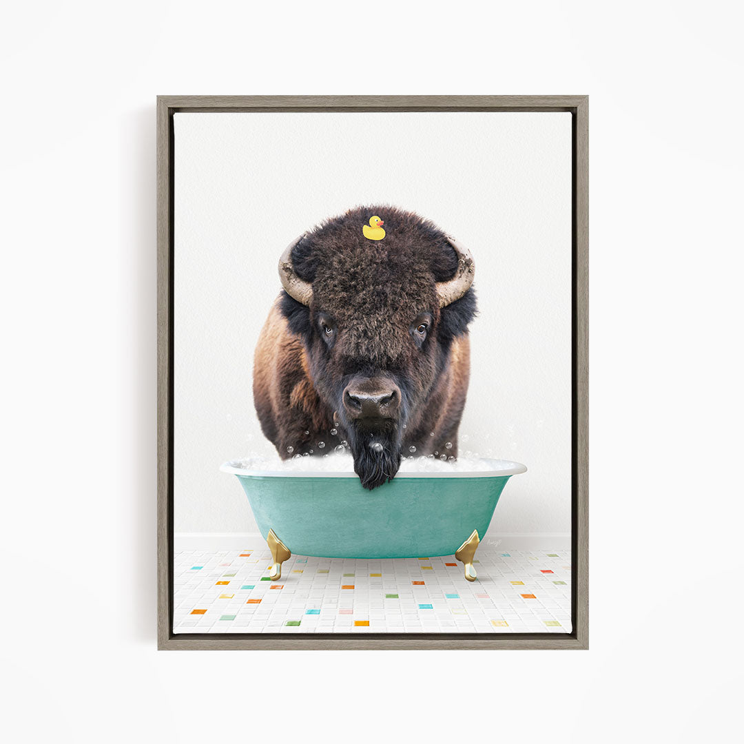 A buffalo with a yellow rubber duck sitting in a blue tub, creating a whimsical and playful scene.