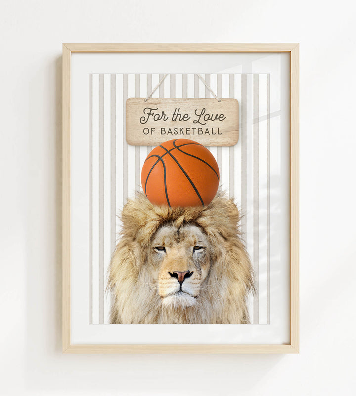 A framed image of a lion with a basketball on its head, accompanied by a wooden sign that reads "For the Love of Basketball".