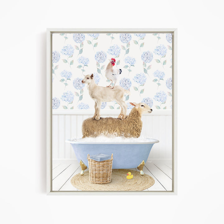 A framed image depicting a sheep standing on a tub filled with bubbles, with a chicken perched on top of it, and a yellow rubber duck floating in the water.