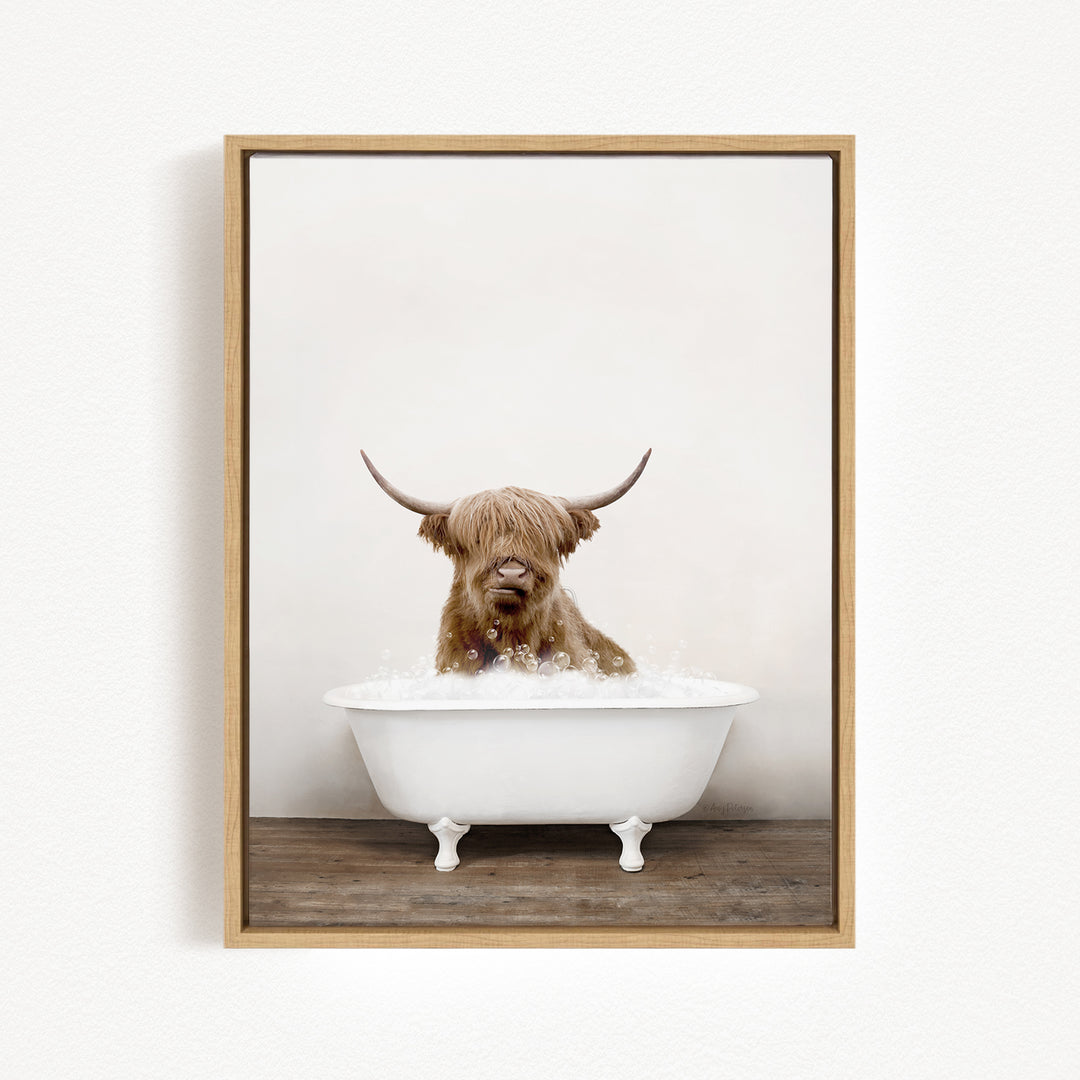 A Highland cow with long horns is sitting in a white bathtub filled with water, creating a whimsical and playful scene.