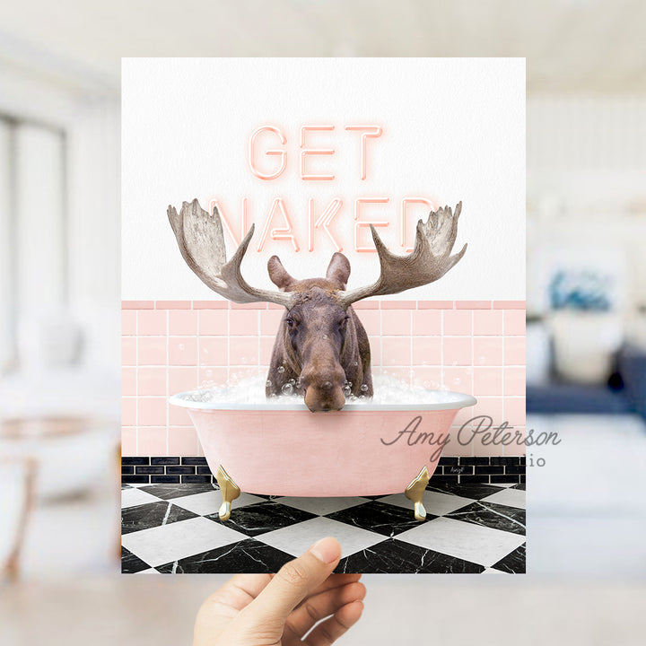 a person holding up a card with a picture of a moose in a bathtub