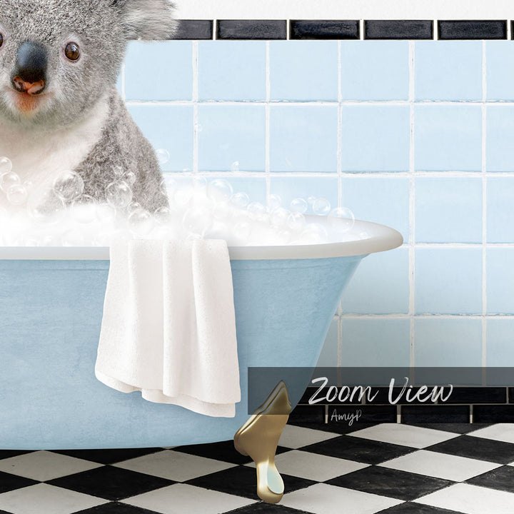 A koala sitting in a blue bathtub filled with bubbles, with a checkered black and white floor in the background.