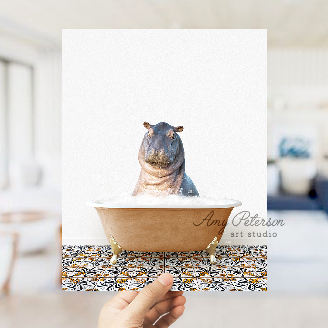 a hippo sitting in a bathtub with a hand holding it