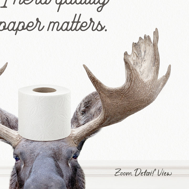 A moose with a roll of toilet paper on its head, accompanied by the text "I prefer quality toilet paper matters."